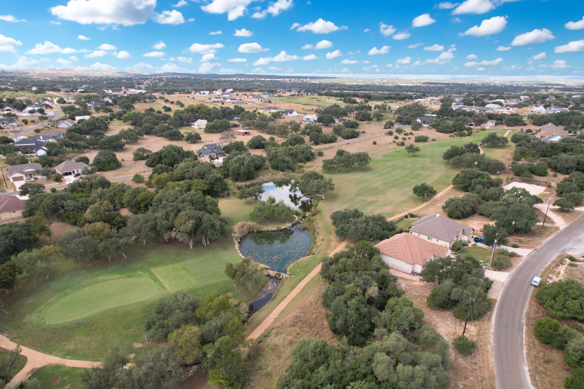204 Jeff Vaughn Blanco, TX 78606 - Photo 5 of 13 an aerial view of residential houses with outdoor space and lake view