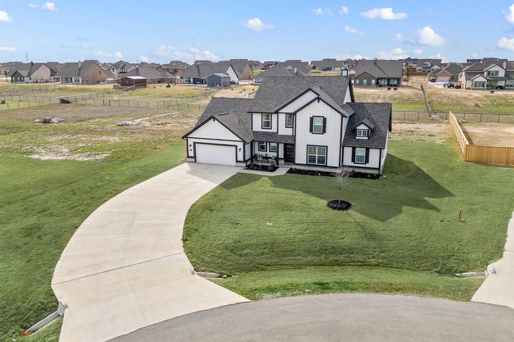 127 Clearwater Court Rhome, TX 76078 - Photo 1 of 1 an aerial view of a house with a lake view
