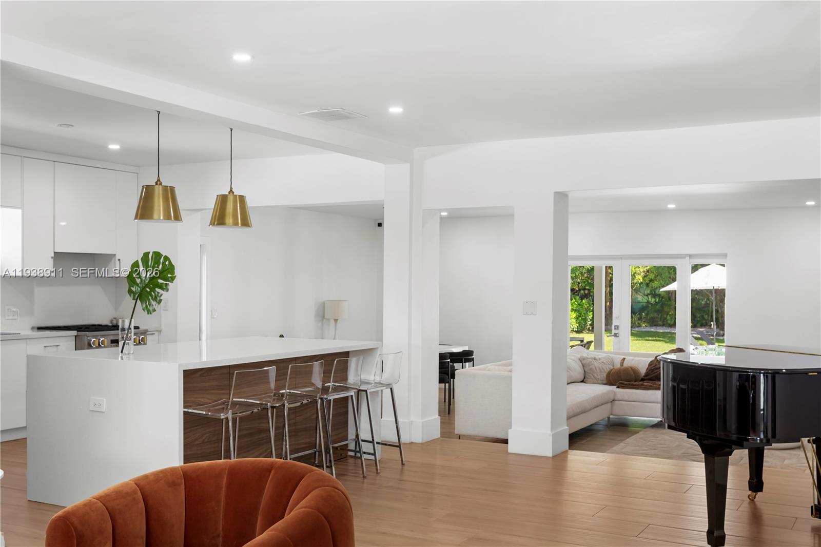 7825 Southwest 72nd Avenue Miami, FL 33143 - Photo 12 of 30 a living room with furniture potted plant and a large window