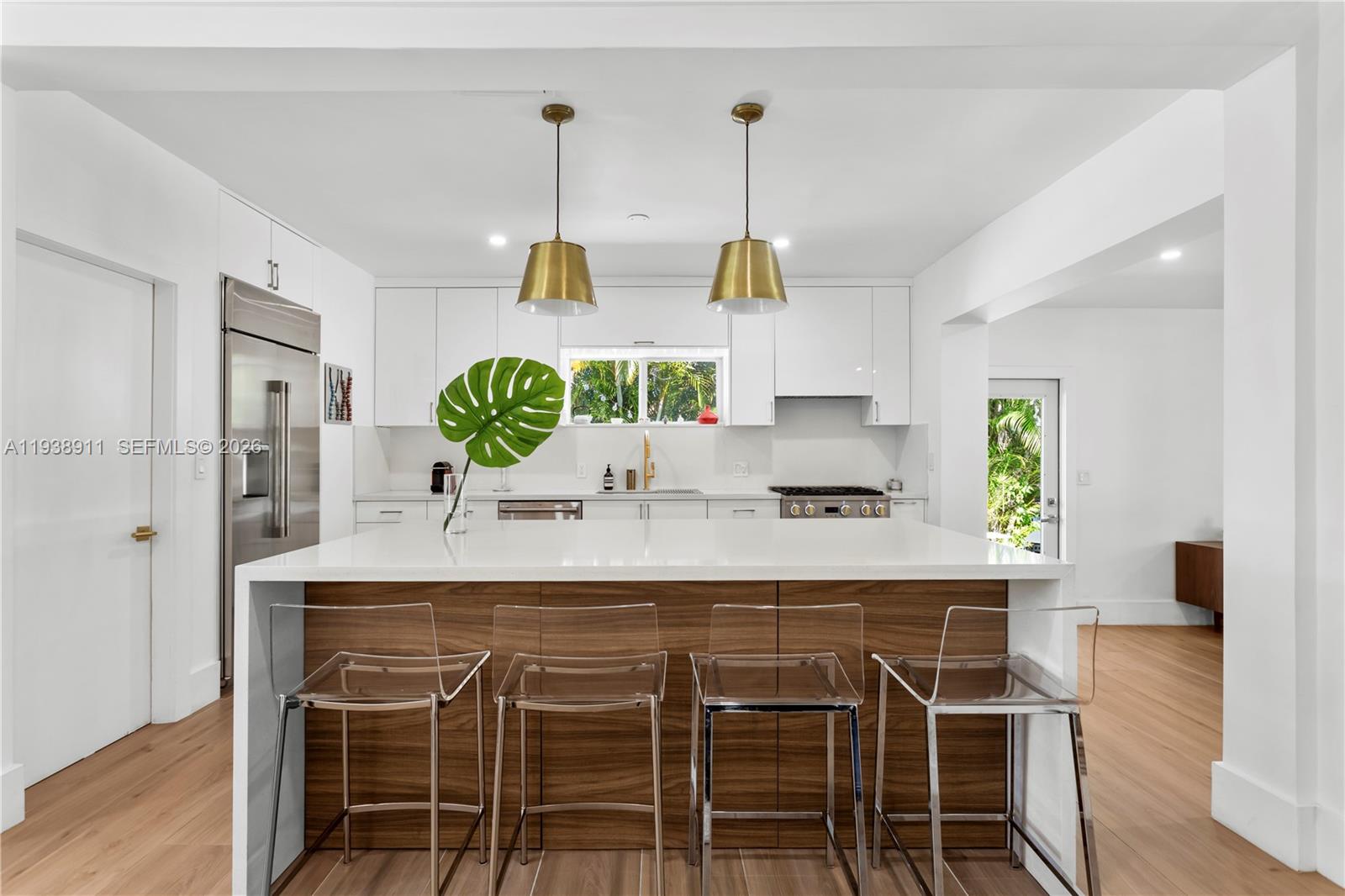 7825 Southwest 72nd Avenue Miami, FL 33143 - Photo 14 of 30 a kitchen with a table and chairs