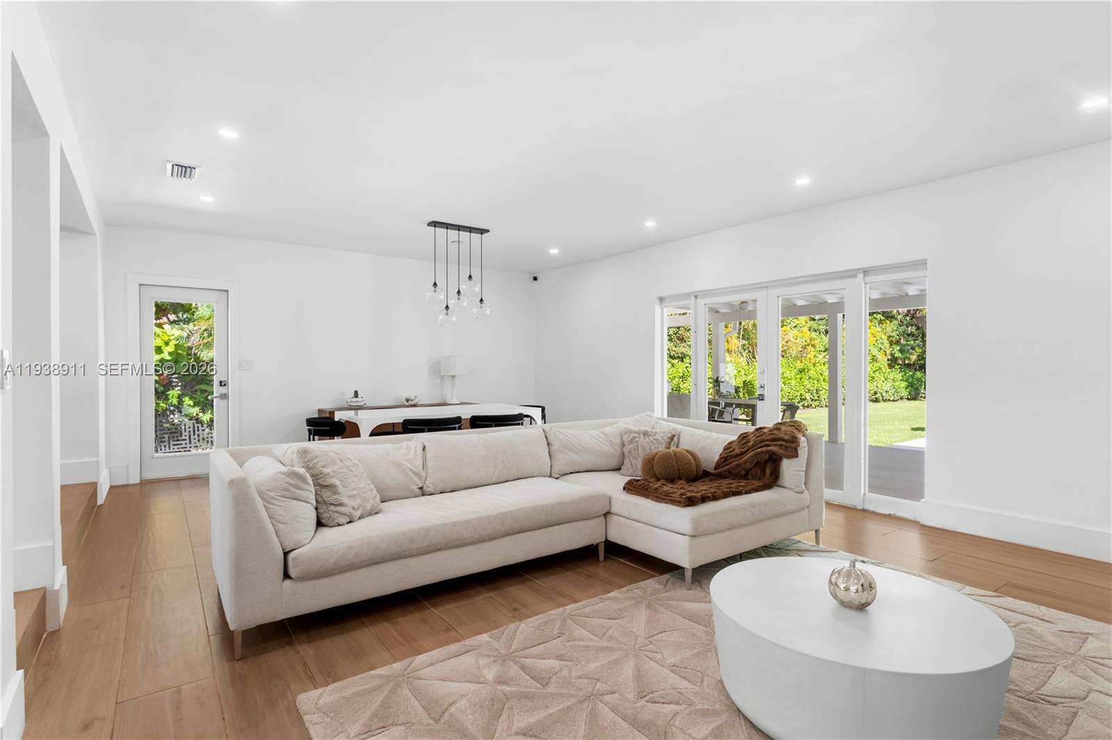 7825 Southwest 72nd Avenue Miami, FL 33143 - Photo 18 of 30 a living room with furniture and a large window