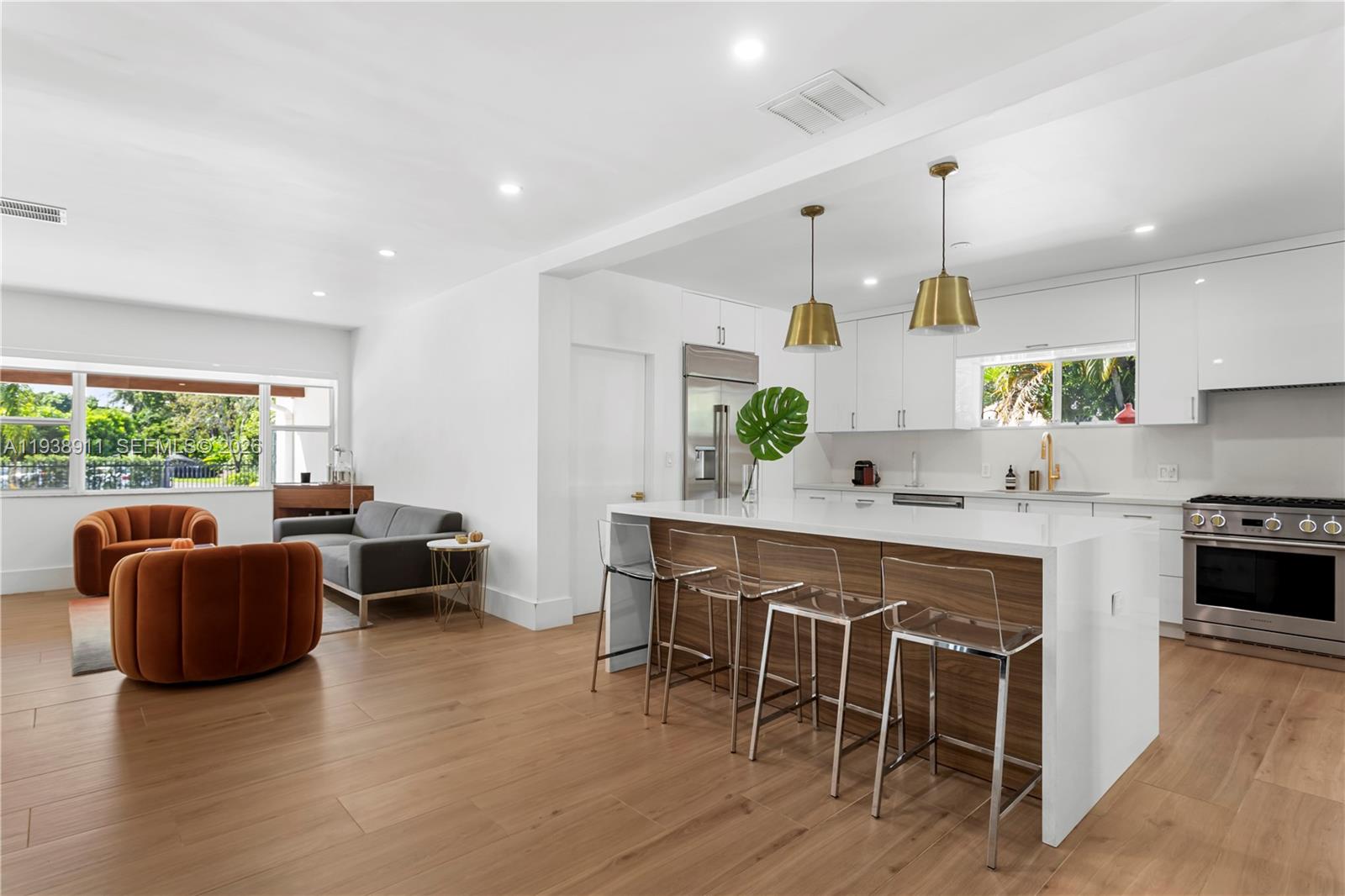 7825 Southwest 72nd Avenue Miami, FL 33143 - Photo 19 of 30 a large kitchen with kitchen island a island a sink a stove and a center island