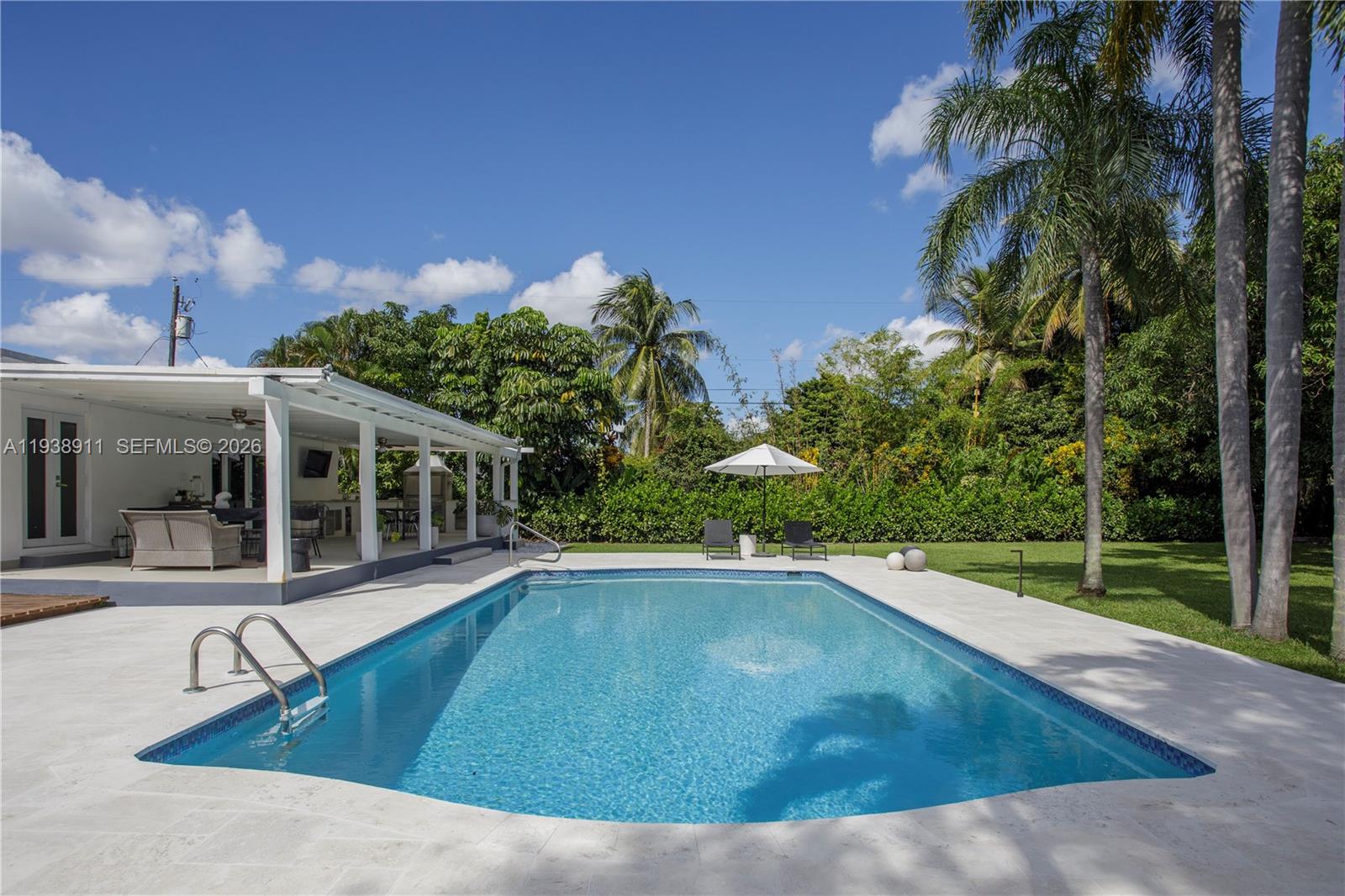 7825 Southwest 72nd Avenue Miami, FL 33143 - Photo 2 of 30 a view of a house with swimming pool