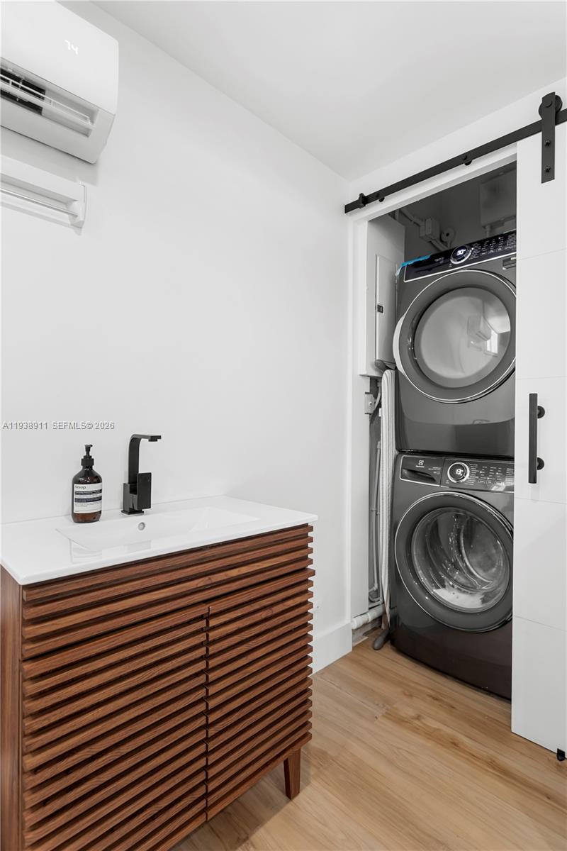 7825 Southwest 72nd Avenue Miami, FL 33143 - Photo 21 of 30 a utility room with sink dryer and washer