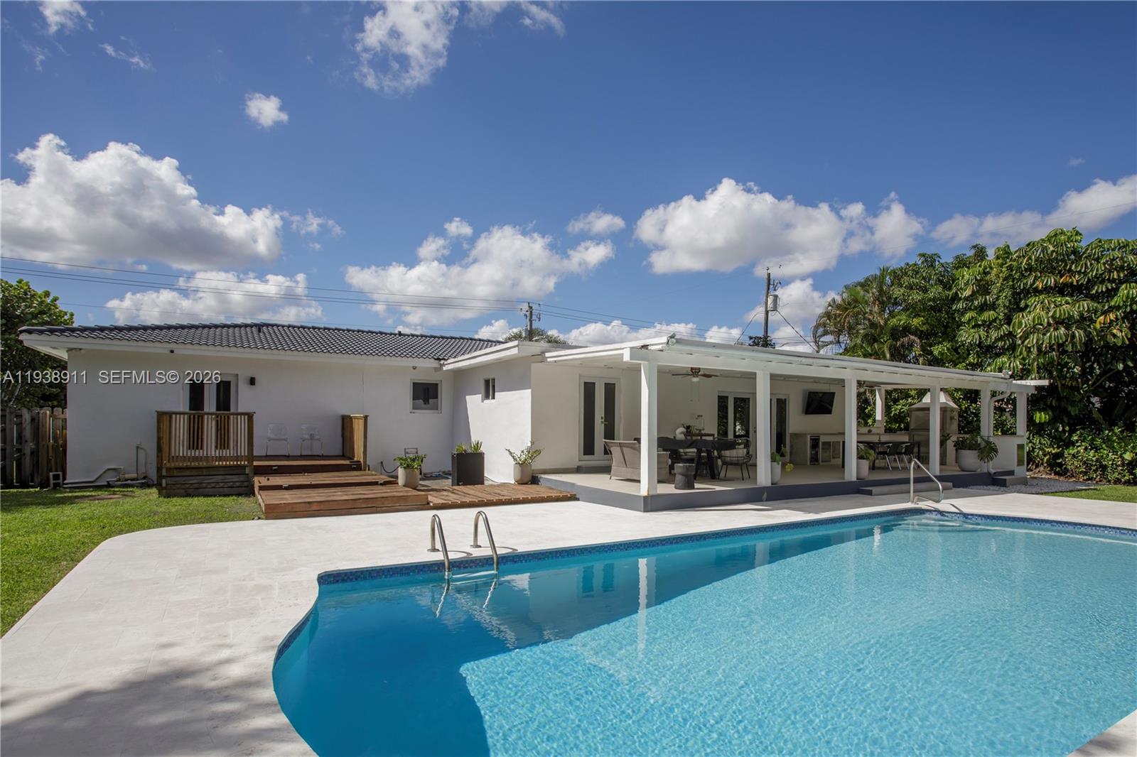7825 Southwest 72nd Avenue Miami, FL 33143 - Photo 23 of 30 a view of a house with swimming pool and sitting area