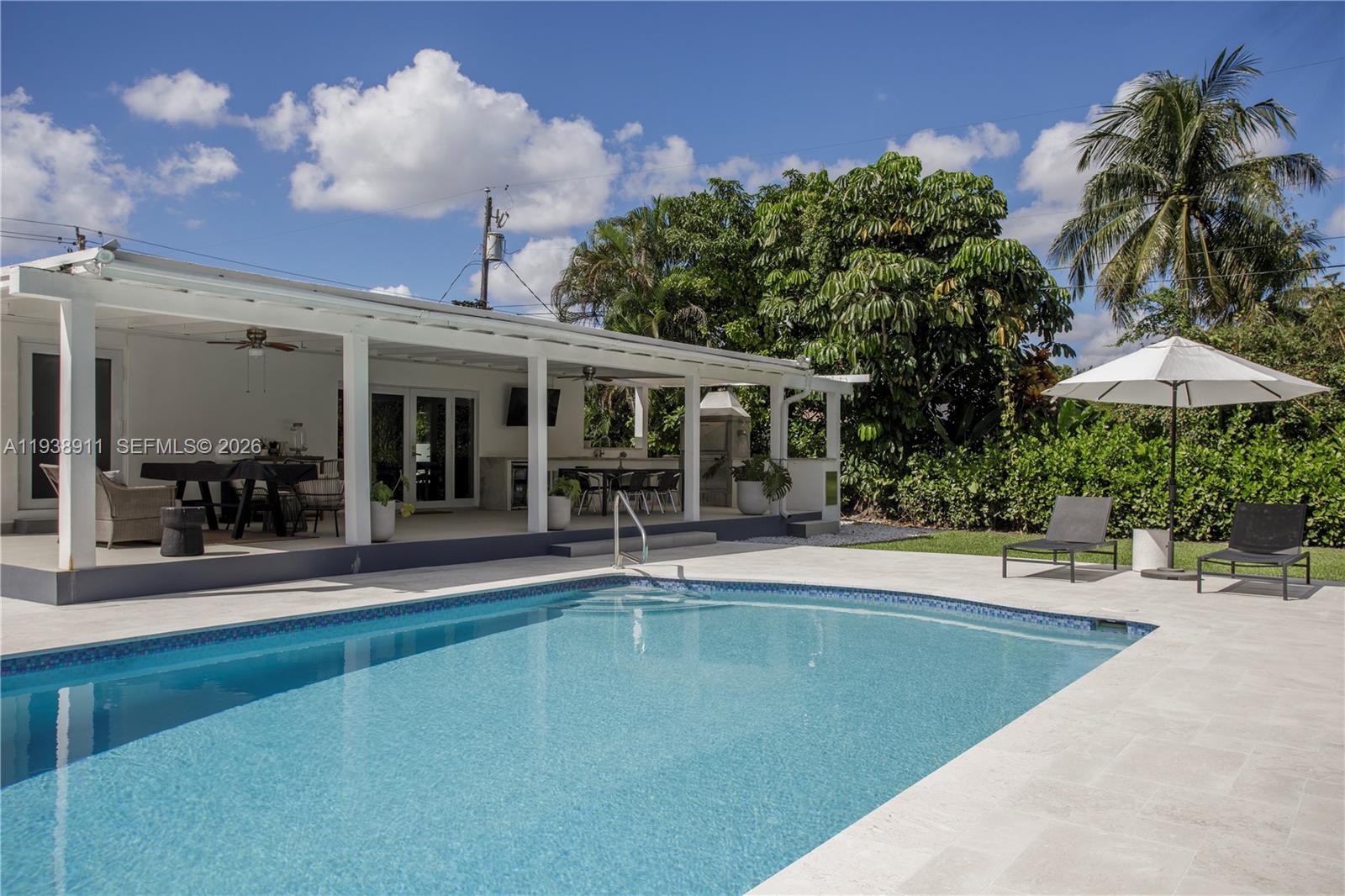 7825 Southwest 72nd Avenue Miami, FL 33143 - Photo 24 of 30 a view of a house with swimming pool and sitting area