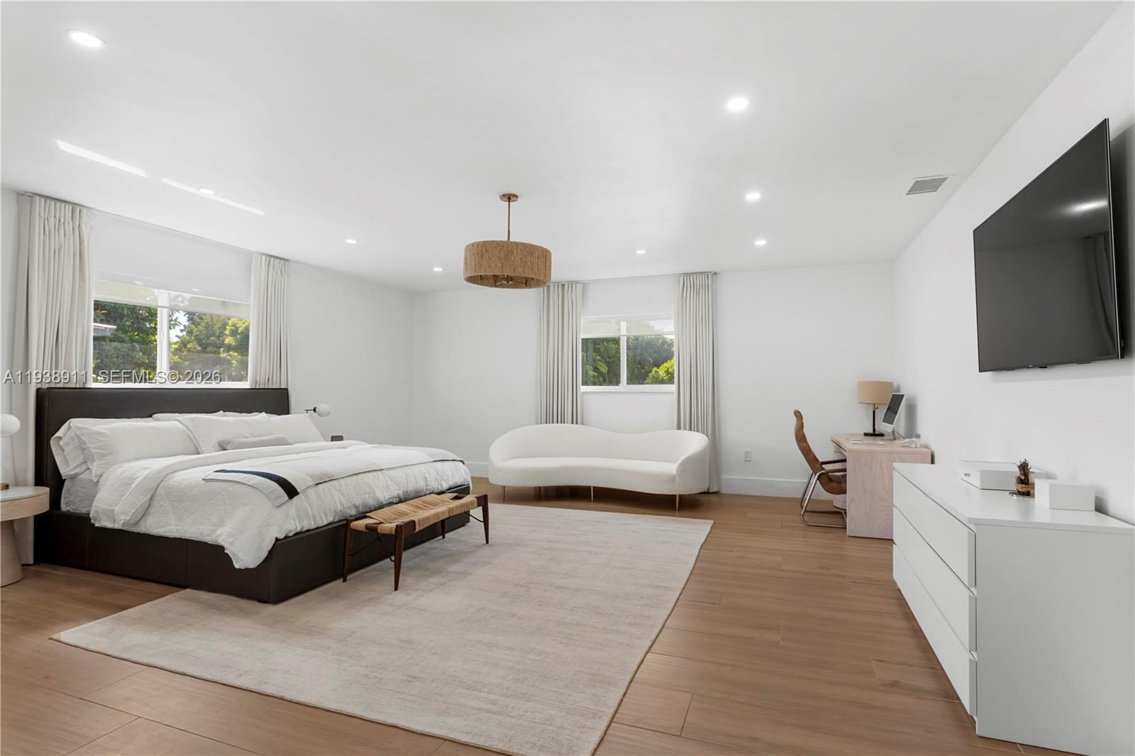 7825 Southwest 72nd Avenue Miami, FL 33143 - Photo 6 of 30 a spacious bedroom with a bed and a flat screen television