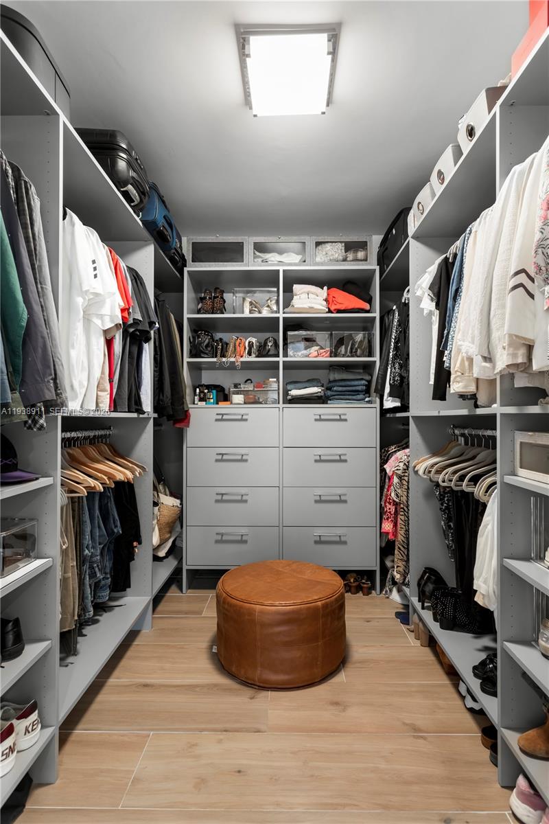 7825 Southwest 72nd Avenue Miami, FL 33143 - Photo 7 of 30 a view of walk in closet with clothes and shoes