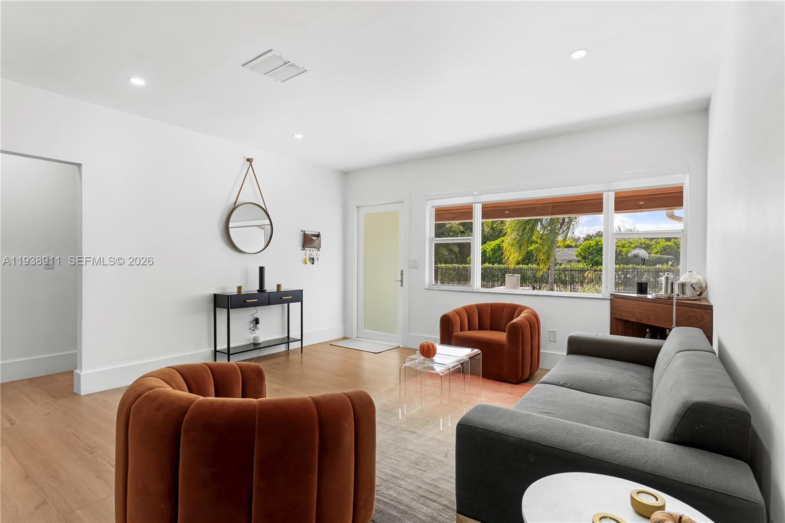 7825 Southwest 72nd Avenue Miami, FL 33143 - Photo 9 of 30 a living room with furniture and a window