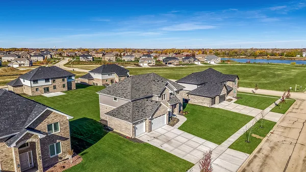 an aerial view of a house with a garden