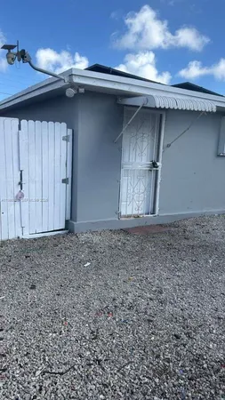a bathroom with a toilet sink and vanity