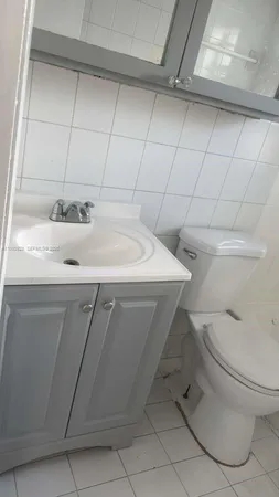 a kitchen with granite countertop a sink