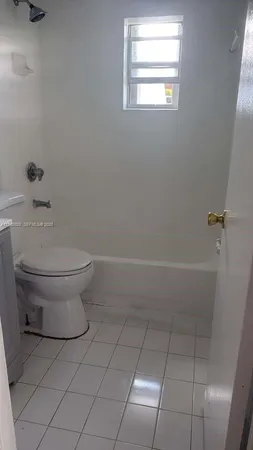 a kitchen with granite countertop a stove and a sink