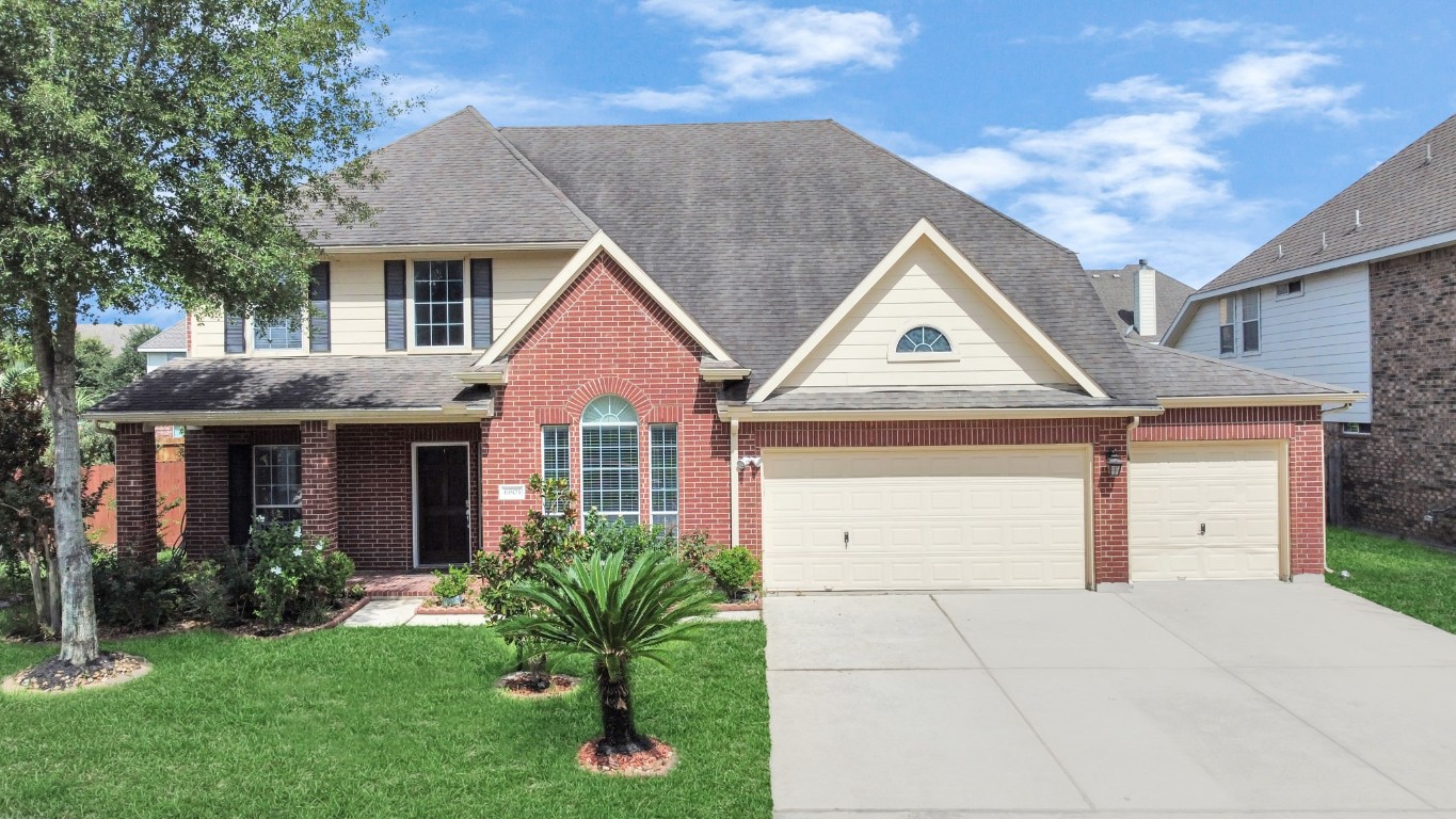 6803 Chapelfield Lane Houston, TX 77049 - Photo 1 of 50 a front view of a house with a yard and garage