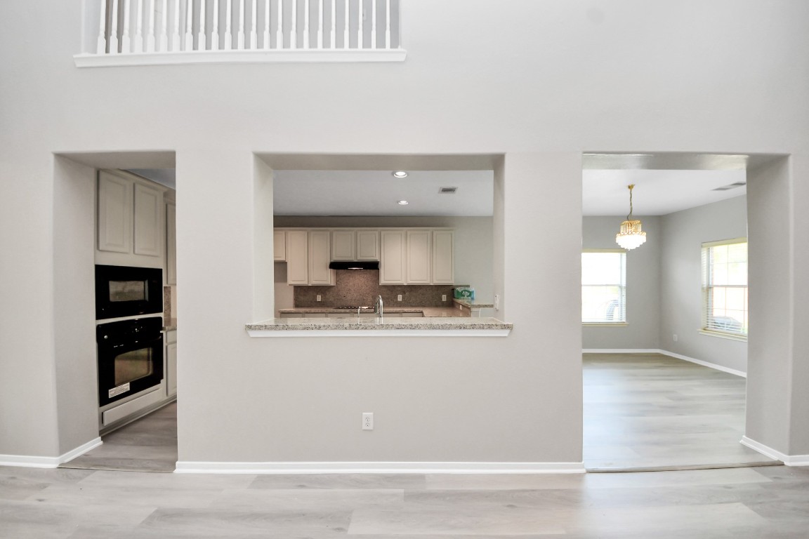 6803 Chapelfield Lane Houston, TX 77049 - Photo 18 of 50 a view of kitchen with kitchen island sink and refrigerator