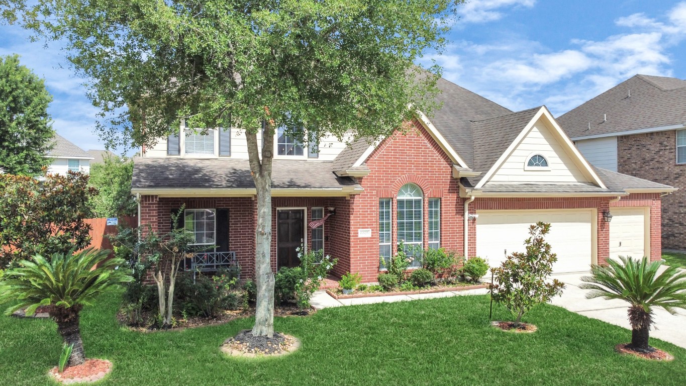 6803 Chapelfield Lane Houston, TX 77049 - Photo 2 of 50 a front view of a house with a yard