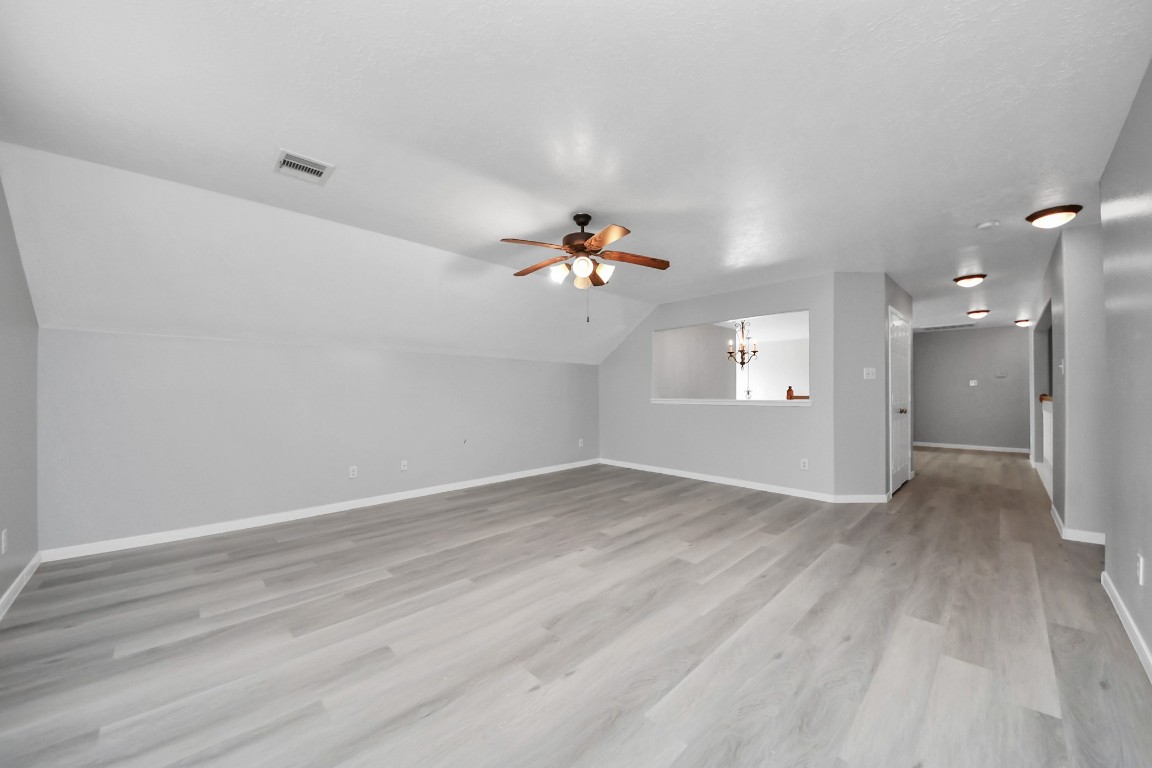 6803 Chapelfield Lane Houston, TX 77049 - Photo 26 of 50 wooden floor in an empty room with a window