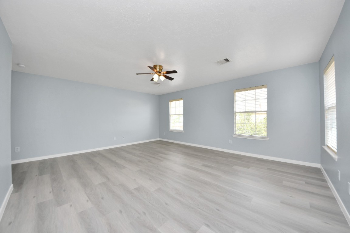 6803 Chapelfield Lane Houston, TX 77049 - Photo 28 of 50 wooden floor in an empty room with a window