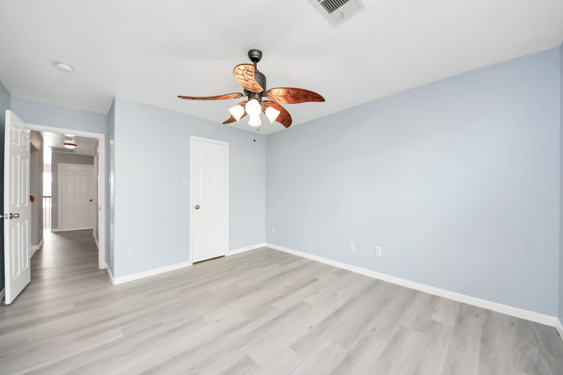 6803 Chapelfield Lane Houston, TX 77049 - Photo 31 of 50 a view of an empty room and wooden floor