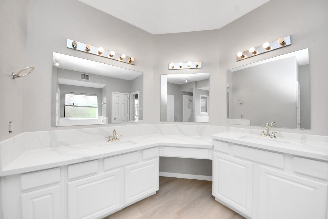 6803 Chapelfield Lane Houston, TX 77049 - Photo 36 of 50 a bathroom with a double vanity sink mirror and bathtub