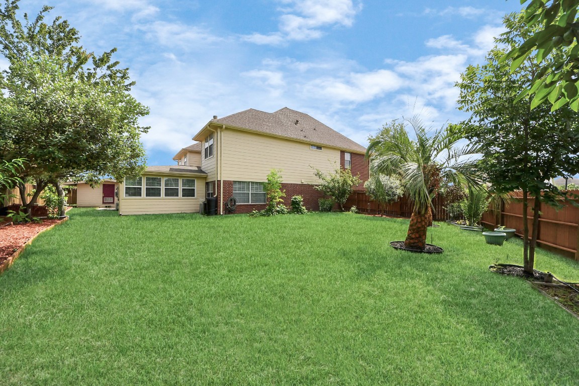 6803 Chapelfield Lane Houston, TX 77049 - Photo 44 of 50 a view of a house with a backyard