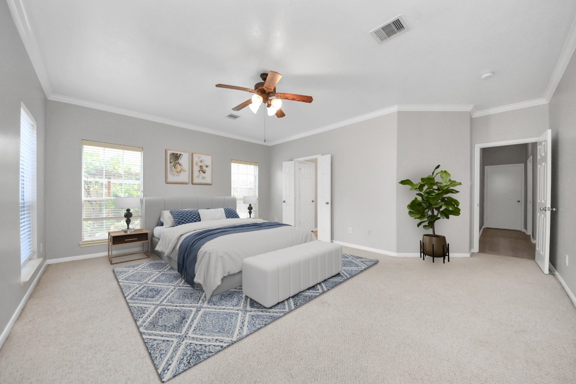 6803 Chapelfield Lane Houston, TX 77049 - Photo 9 of 50 a bedroom with a bed and a chandelier