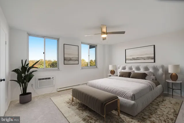 a bedroom with bed and window