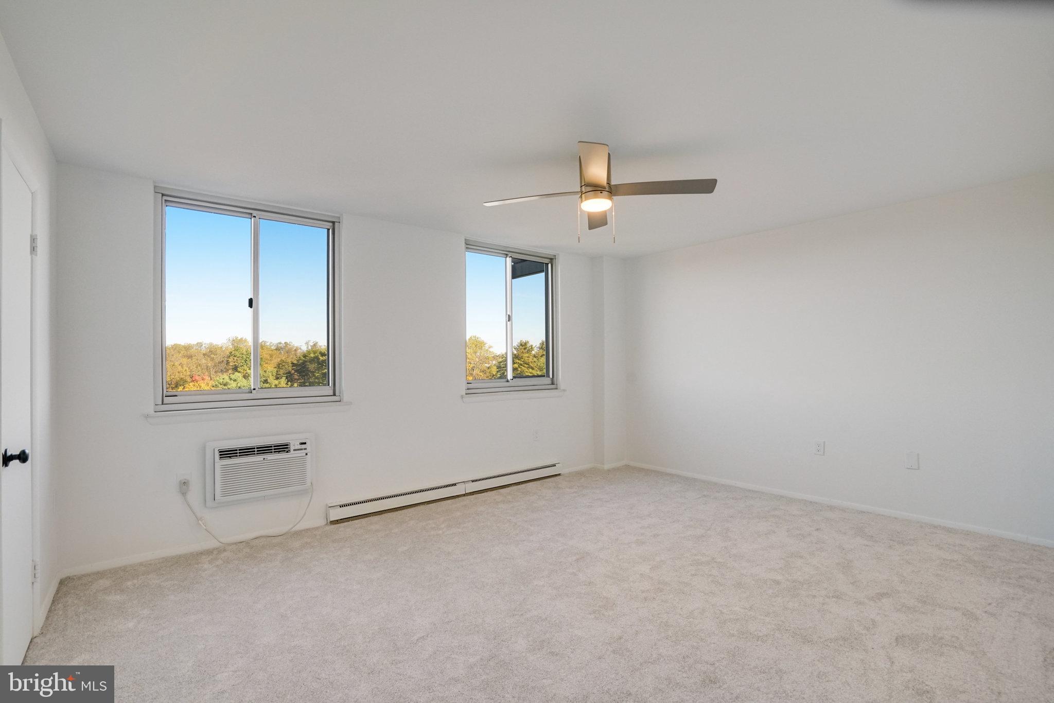 3245 Rio Drive, Unit 901 Falls Church, VA 22041 - Photo 22 of 38 an empty room with chandelier fan and windows