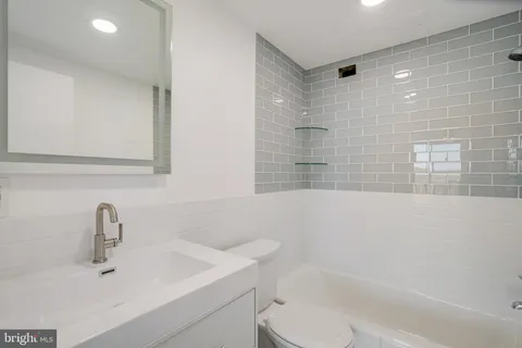 a bathroom with a sink and a bathtub