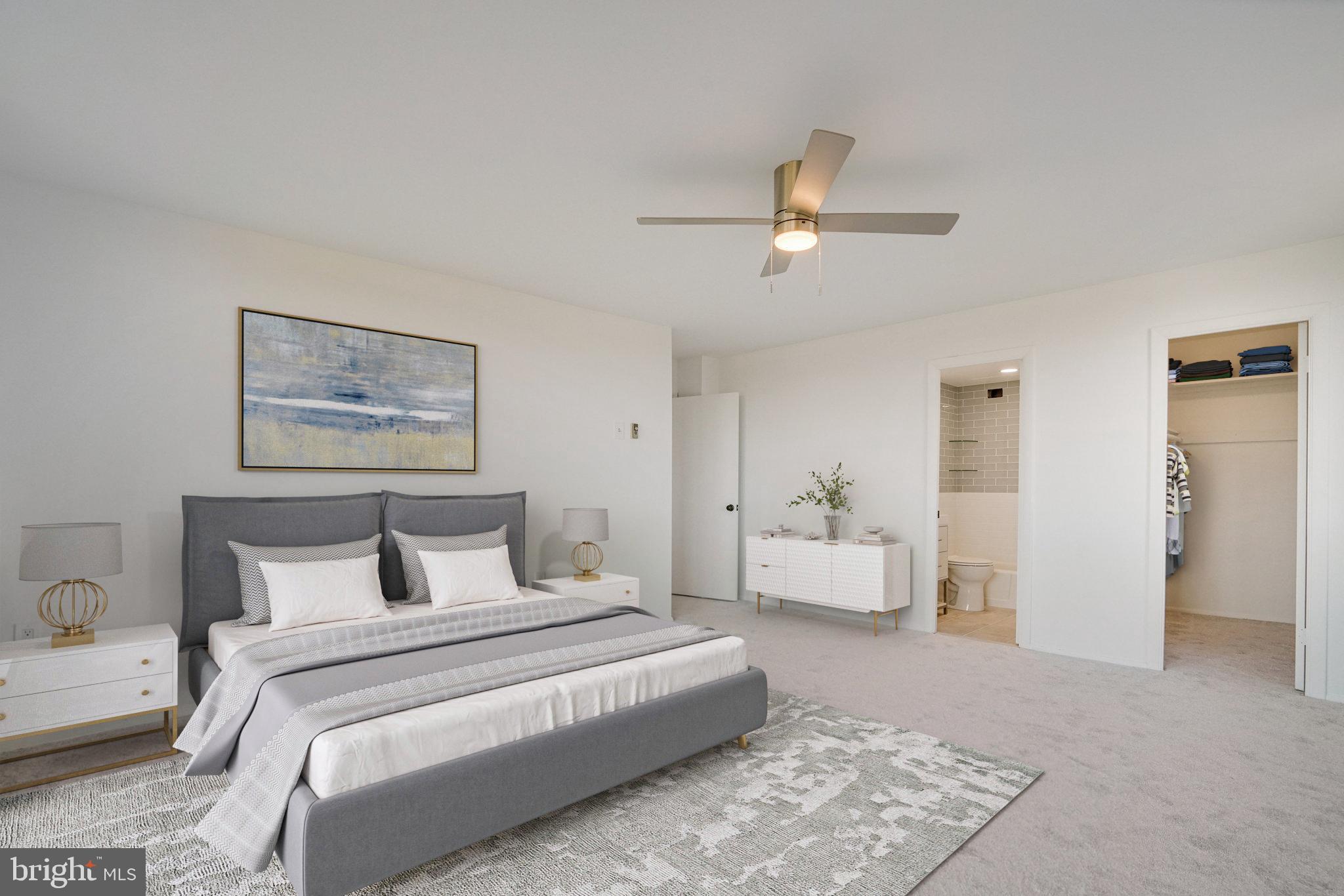 3245 Rio Drive, Unit 901 Falls Church, VA 22041 - Photo 31 of 38 a bedroom with a large bed and a chandelier