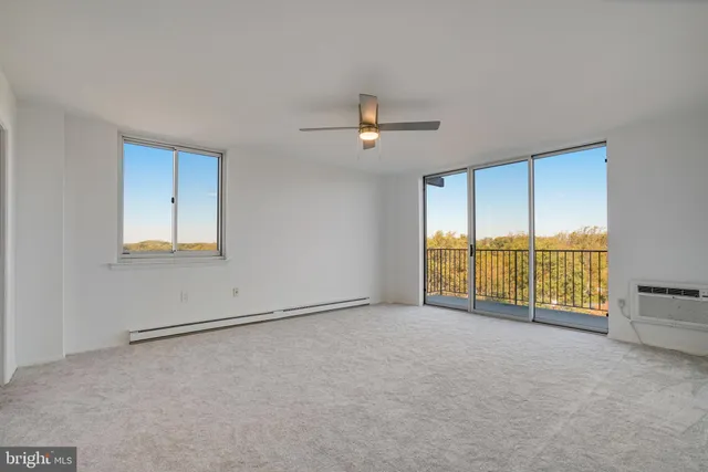 a view of an empty room with a window