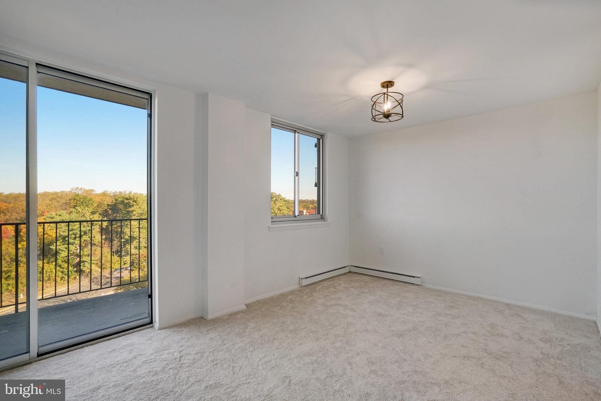 3245 Rio Drive, Unit 901 Falls Church, VA 22041 - Photo 5 of 38 an empty room with windows
