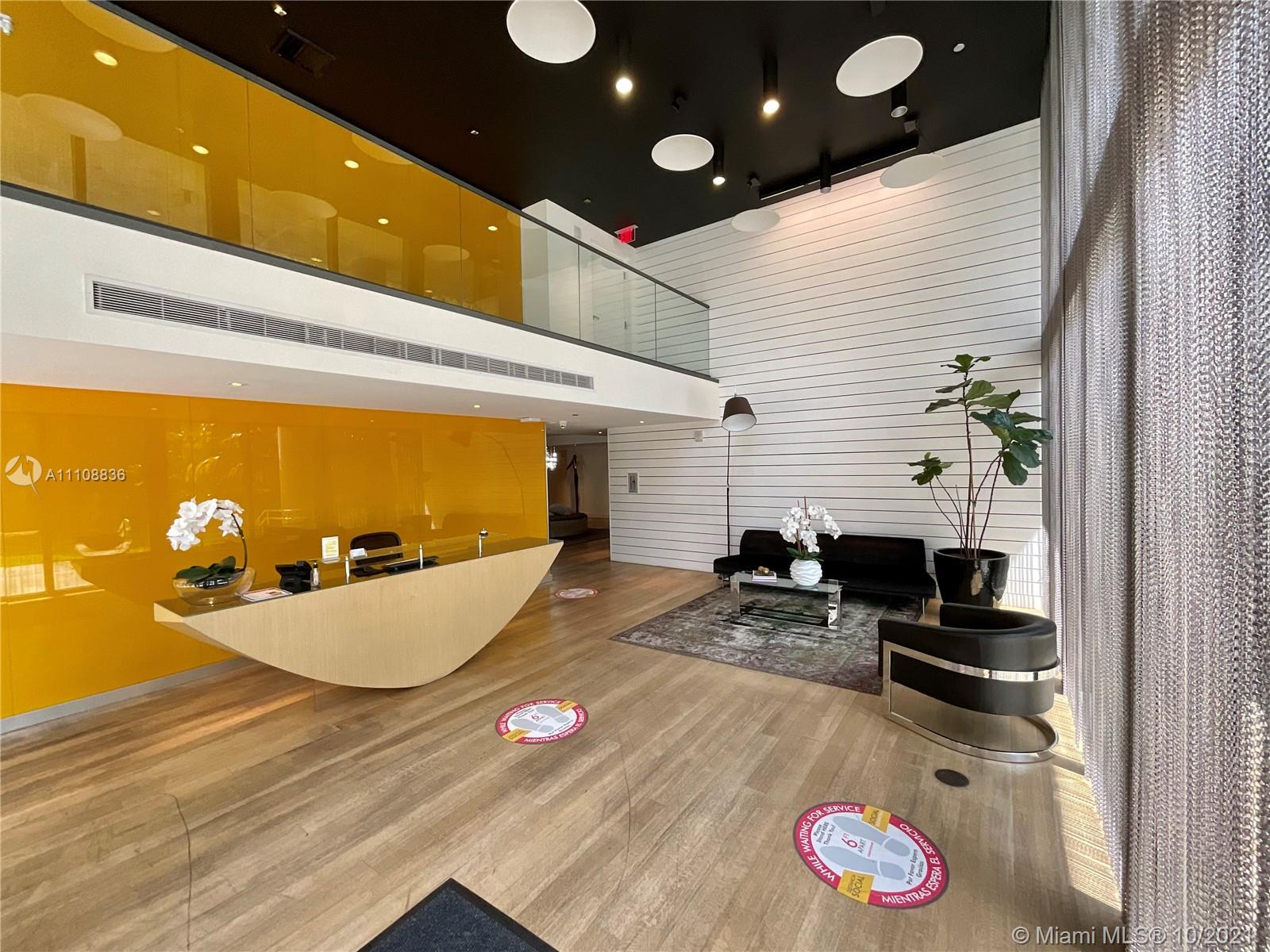 a room with furniture and a flat screen tv