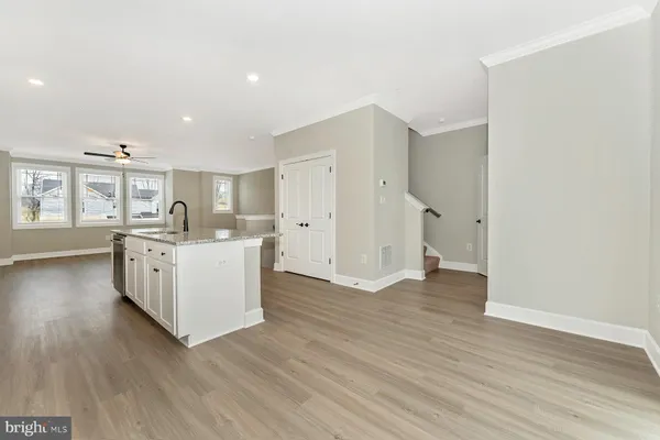 a kitchen with stainless steel appliances granite countertop a sink and cabinets