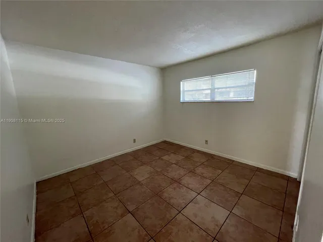 a view of swimming pool with outdoor seating and plants