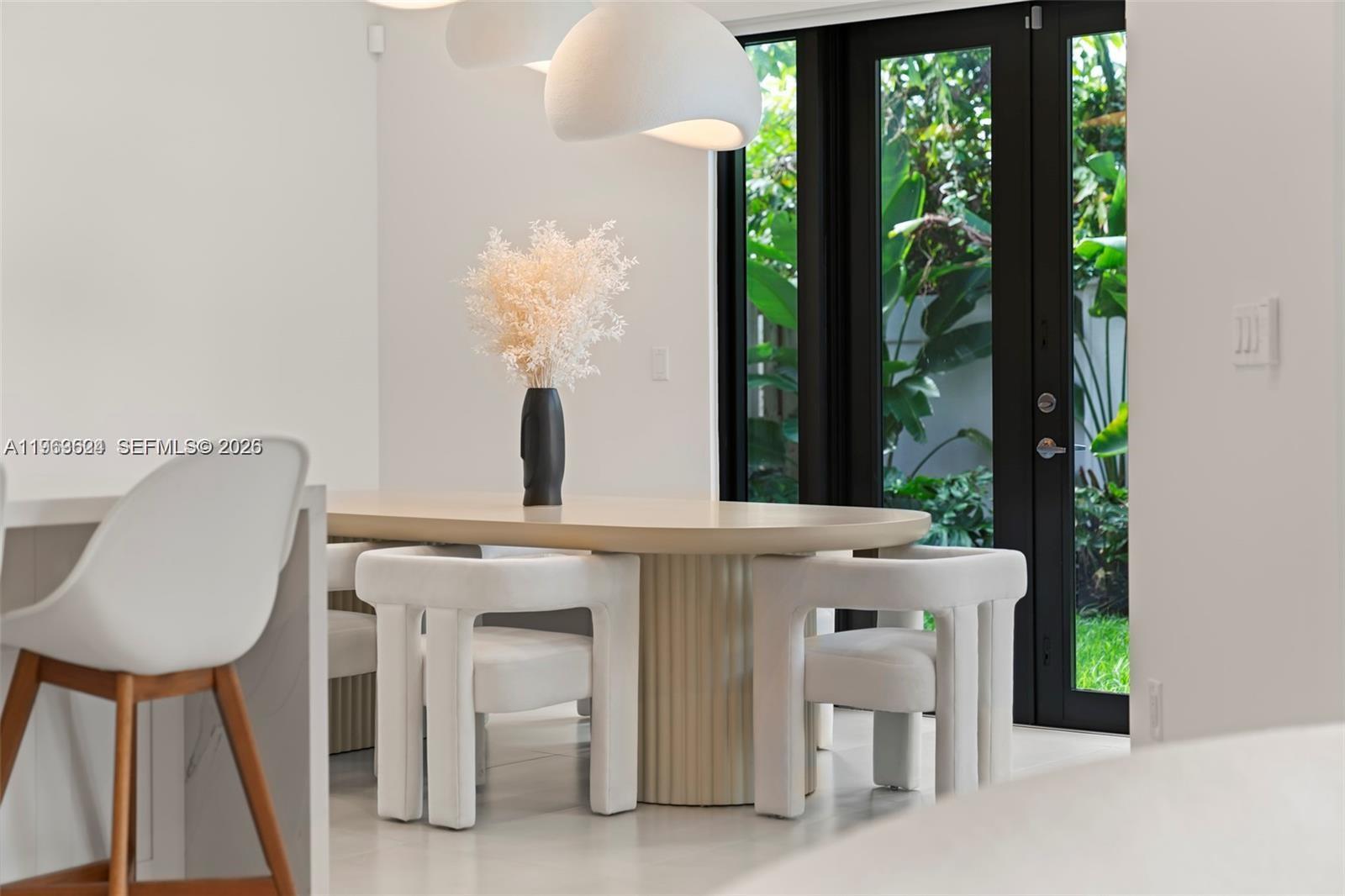 7771 Southwest 99th Street Miami, FL 33156 - Photo 13 of 33 a view of a dining room with furniture window and outside view