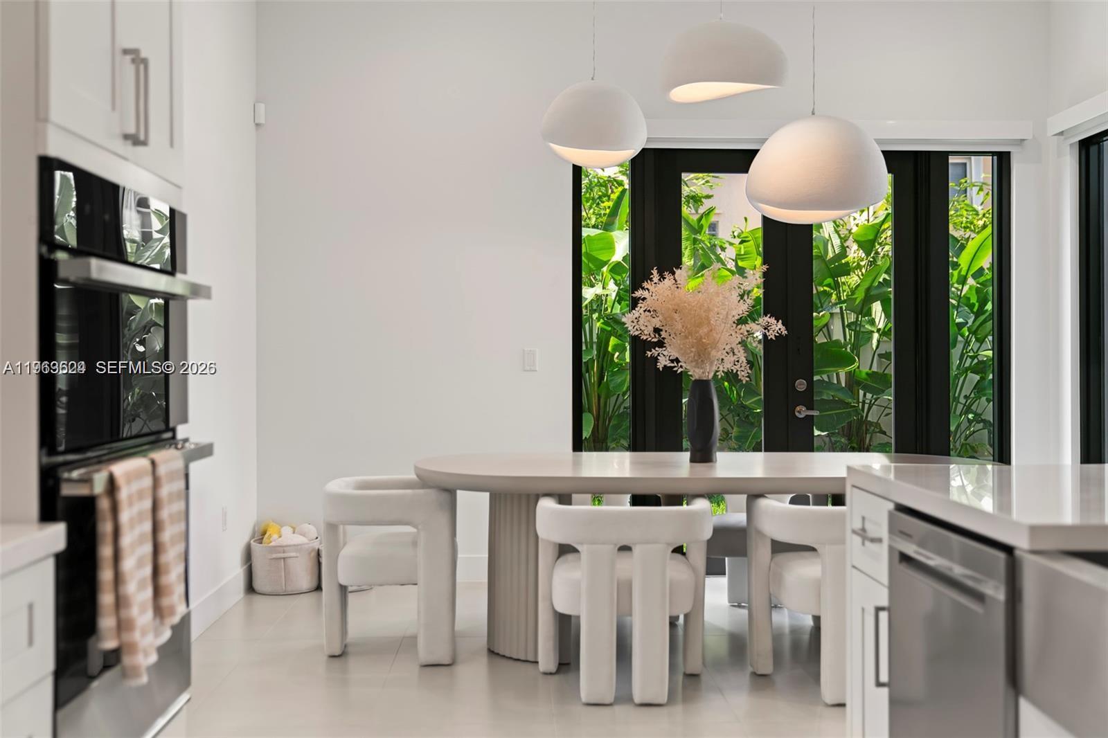 7771 Southwest 99th Street Miami, FL 33156 - Photo 19 of 33 a view of a dining room with furniture window and wooden floor