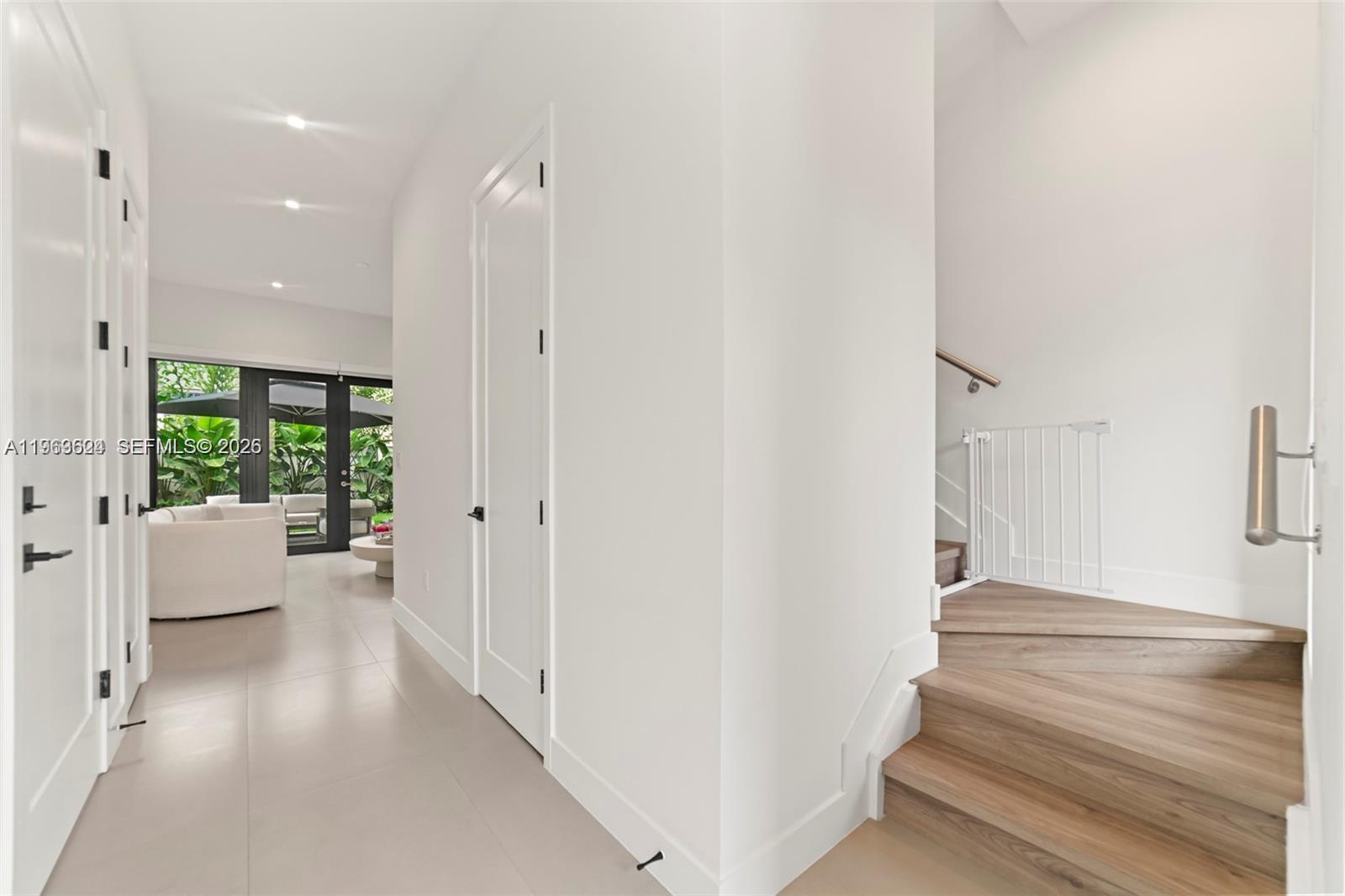 7771 Southwest 99th Street Miami, FL 33156 - Photo 22 of 33 a view of an entryway with wooden floor and windows