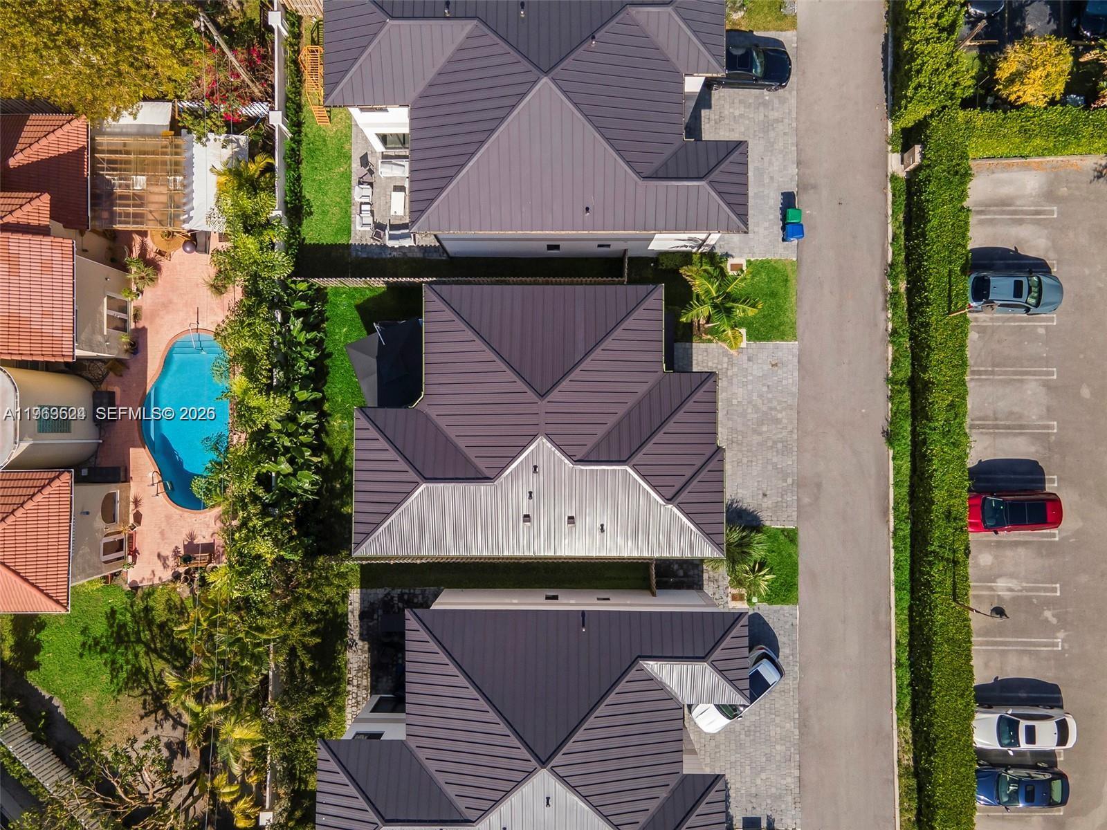 7771 Southwest 99th Street Miami, FL 33156 - Photo 3 of 33 an aerial view of a house with a yard