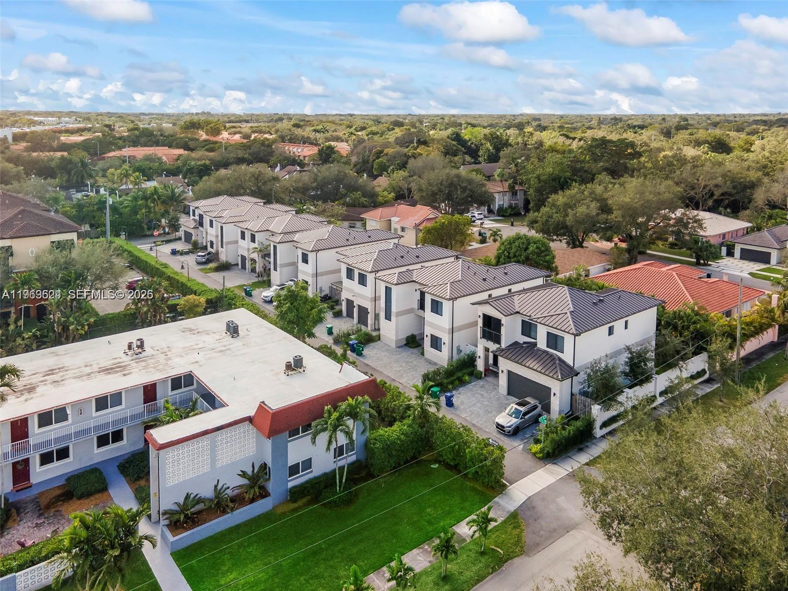 7771 Southwest 99th Street Miami, FL 33156 - Photo 4 of 33 an aerial view of multiple house