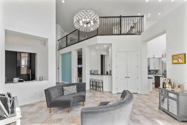 a view of a dining room with furniture and window