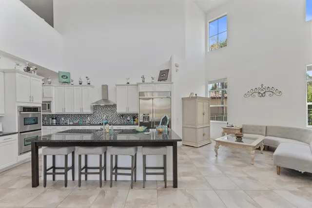 a living room with furniture and flat screen tv