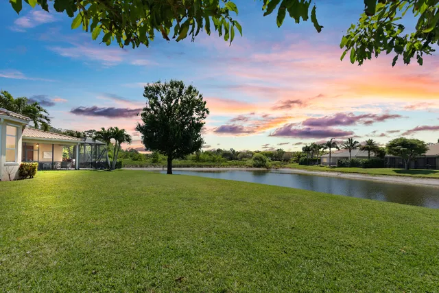 a view of a lake with a houses in the background