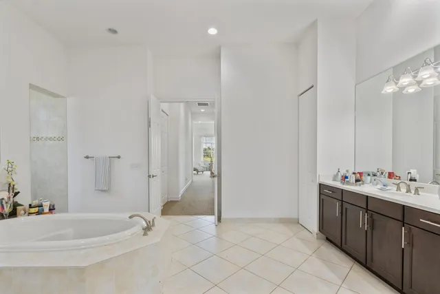 an aerial view of a house with outdoor space and a lake view