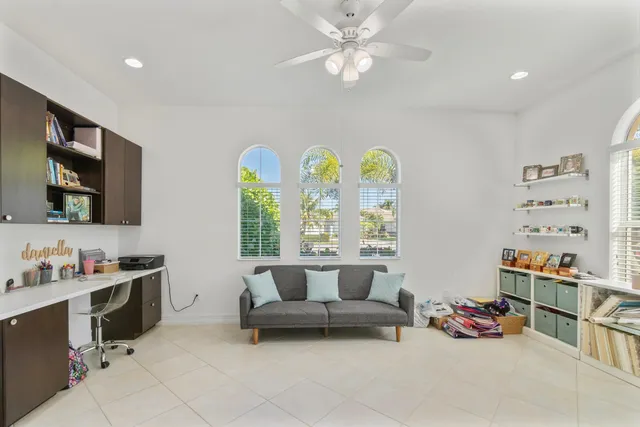 a front view of a house with a garden and a yard