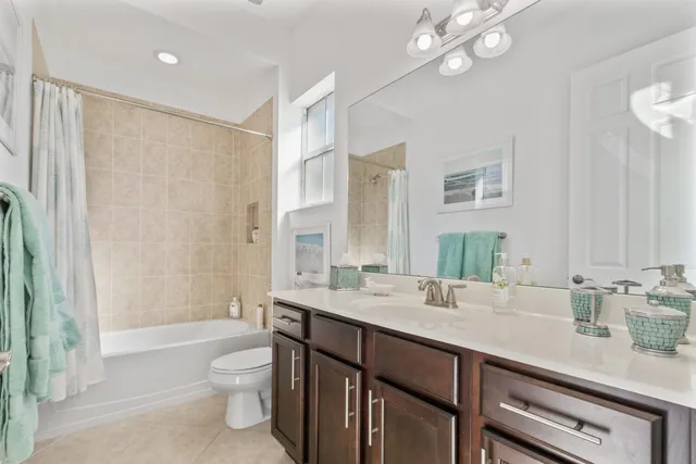 a view of a patio with a table and chairs under an umbrella