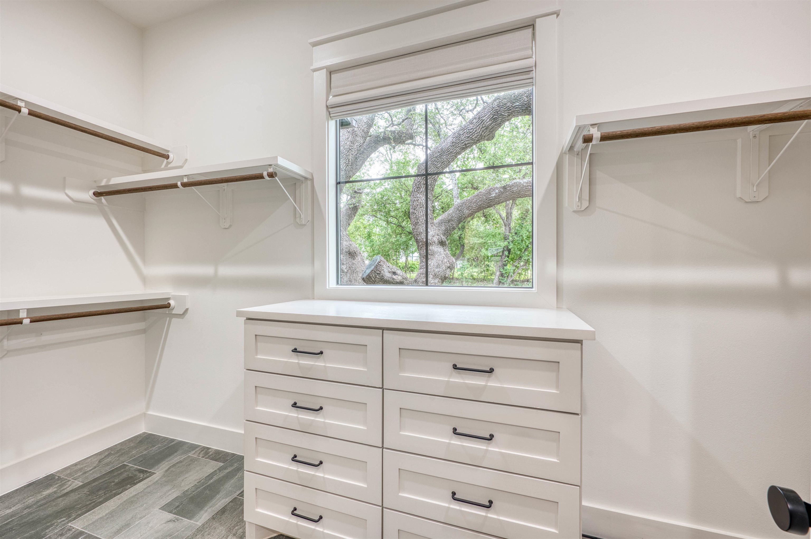 2001 Granite Cove Road Kingsland, TX 78639 - Photo 8 of 42 a view of a dresser with window and cabinet