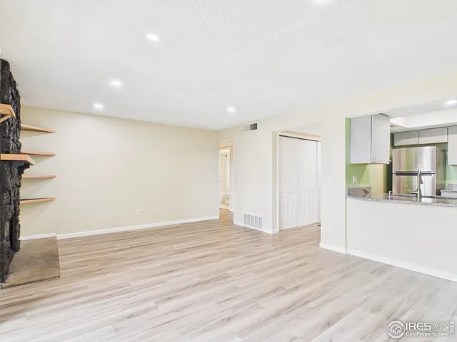 a view of a chairs and table in a patio