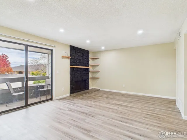a hotel room with furniture and a flat screen tv