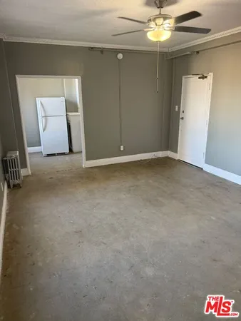a kitchen with stainless steel appliances granite countertop a stove and a refrigerator